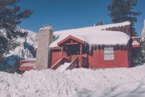 red house covered in snow and ice