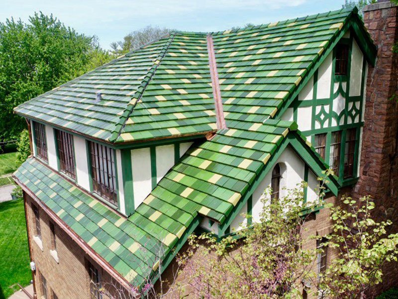 Angled corner view of green Ludowici tile roof project completed by Exterior Remodel & Design in Omaha, NE